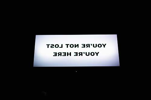 text turned-on flat screen TV paper